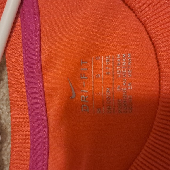 This is a Nike youth sweatshirt, size 6-7. Color: Orange - Picture 4 of 4